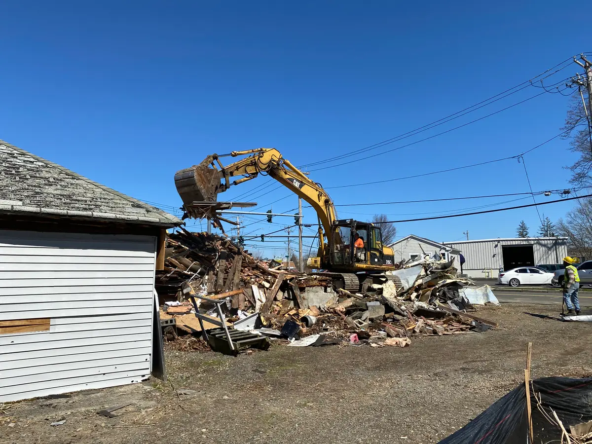 PRC Demolition excavator taking down a structure on the Post Road in Milford, CT