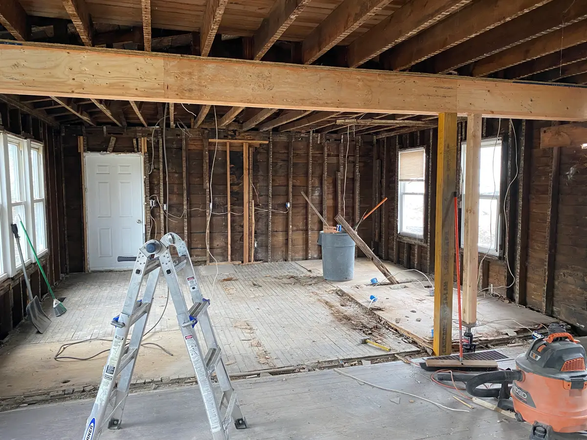 Interior gutted to the studs with new structural beam installed — PRC interior demolition project